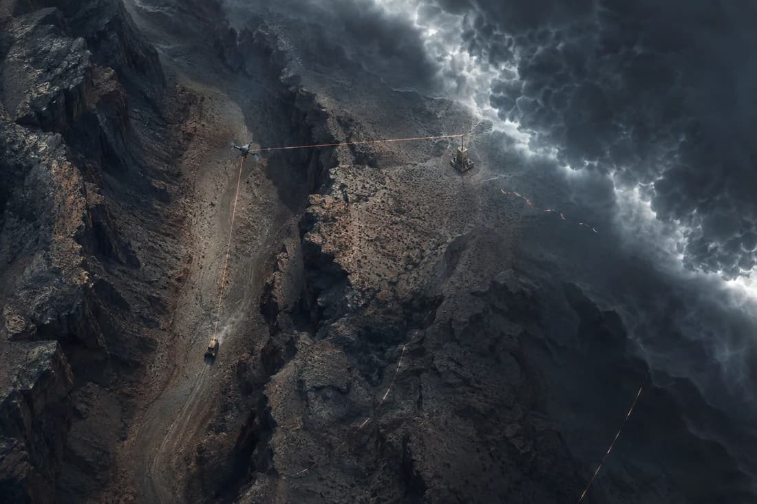Vehicle, drone and base station linked across a canyon under storm clouds.